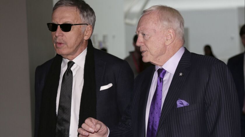 Rams owner Stan Kroenke, left, and Dallas Cowboys owner Jerry Jones talk as they arrive for the NFL fall meetings in New York on Tuesday.