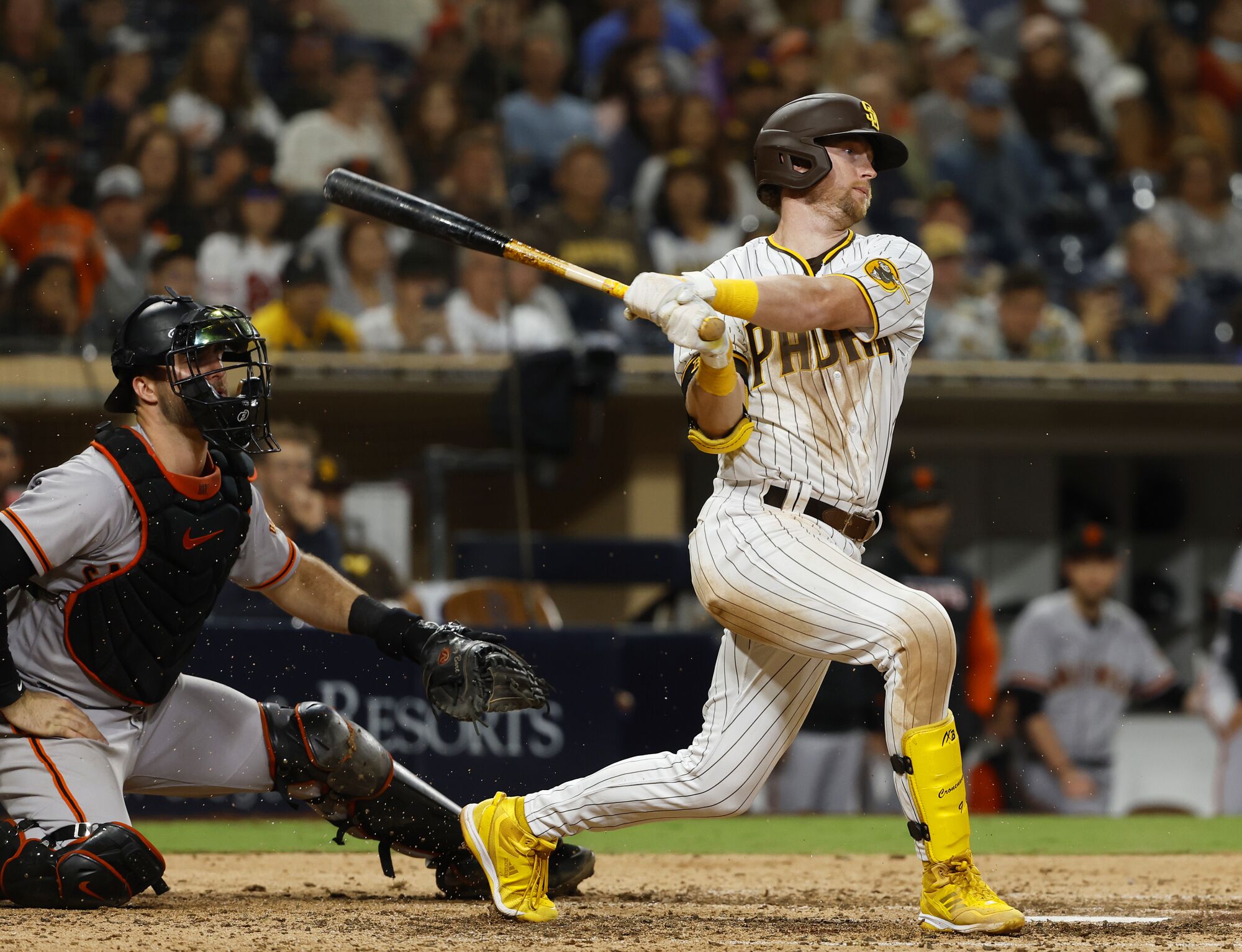 Padres' Jake Cronenworth hits a two-RBI double in the eighth inning.