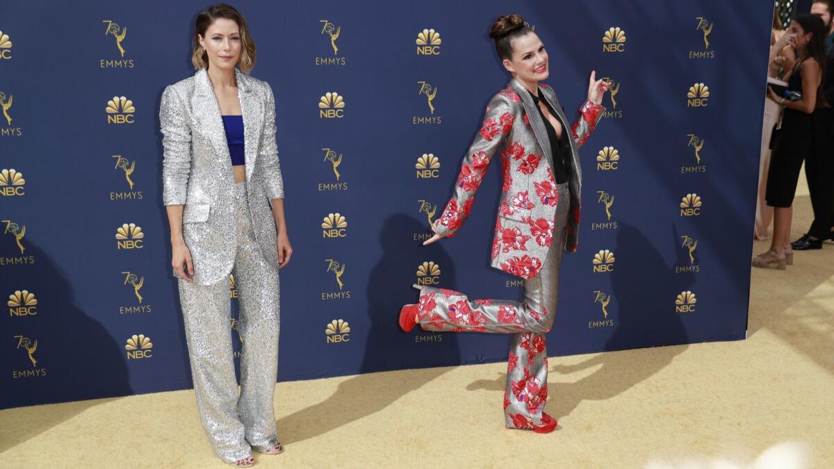 Amanda Crew, left, and Suzanne Cryer show off their ensembles at the 70th Emmy Awards.