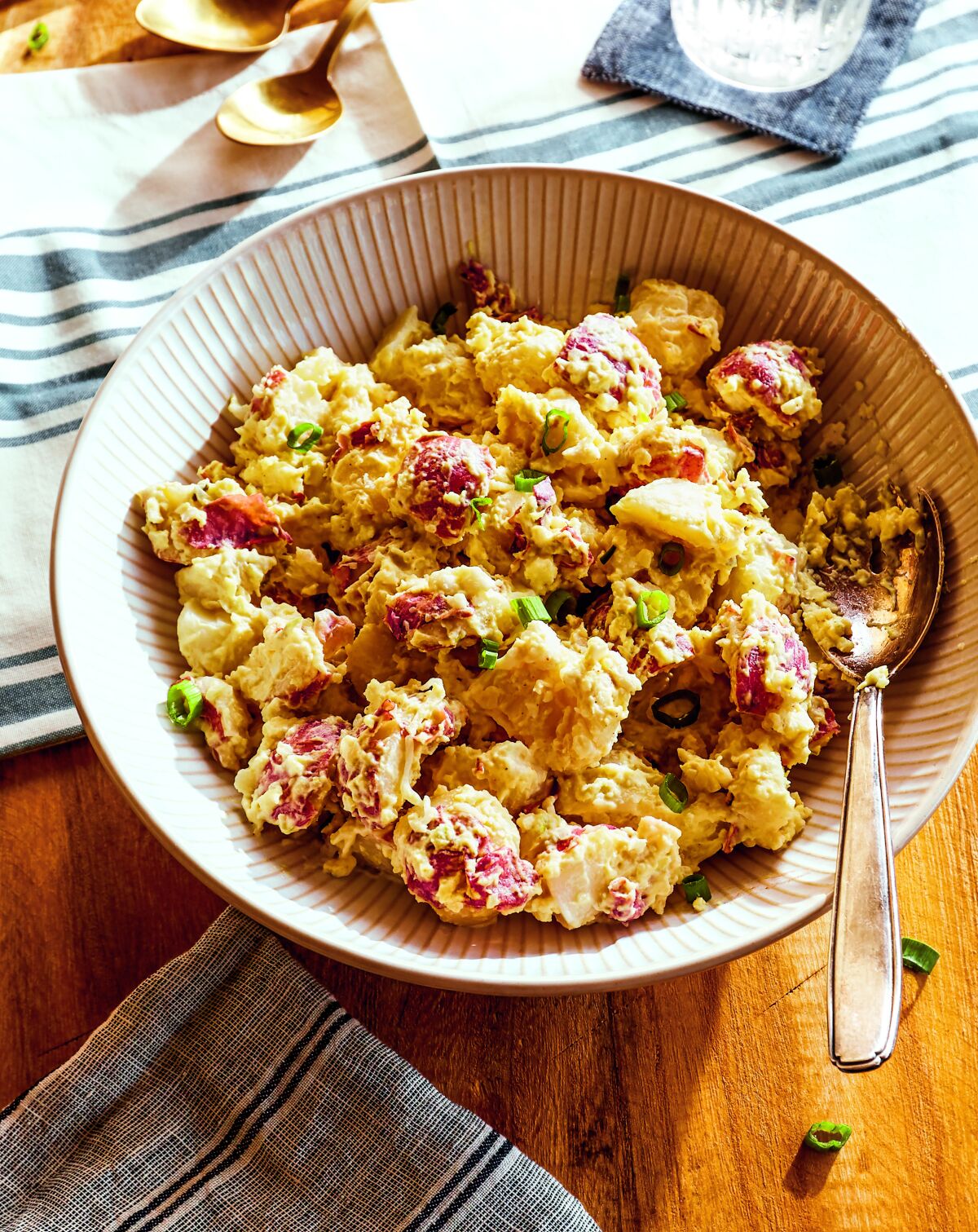  A bowl of potato salad made with red-skin potatoes.
