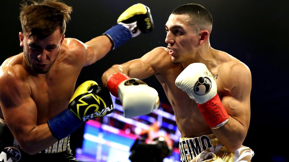 Teofimo Lopez, right, knocks out Mason Menard in the first round during their lightweight fight at Hulu Theater at Madison Square Garden on Dec. 8, 2018.