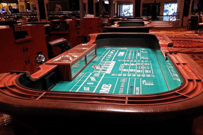 The conviviality and excitement of a crowd craps table will likely disappear when Caesars Palace reopens. State regulators will limit craps games to six players at each table.