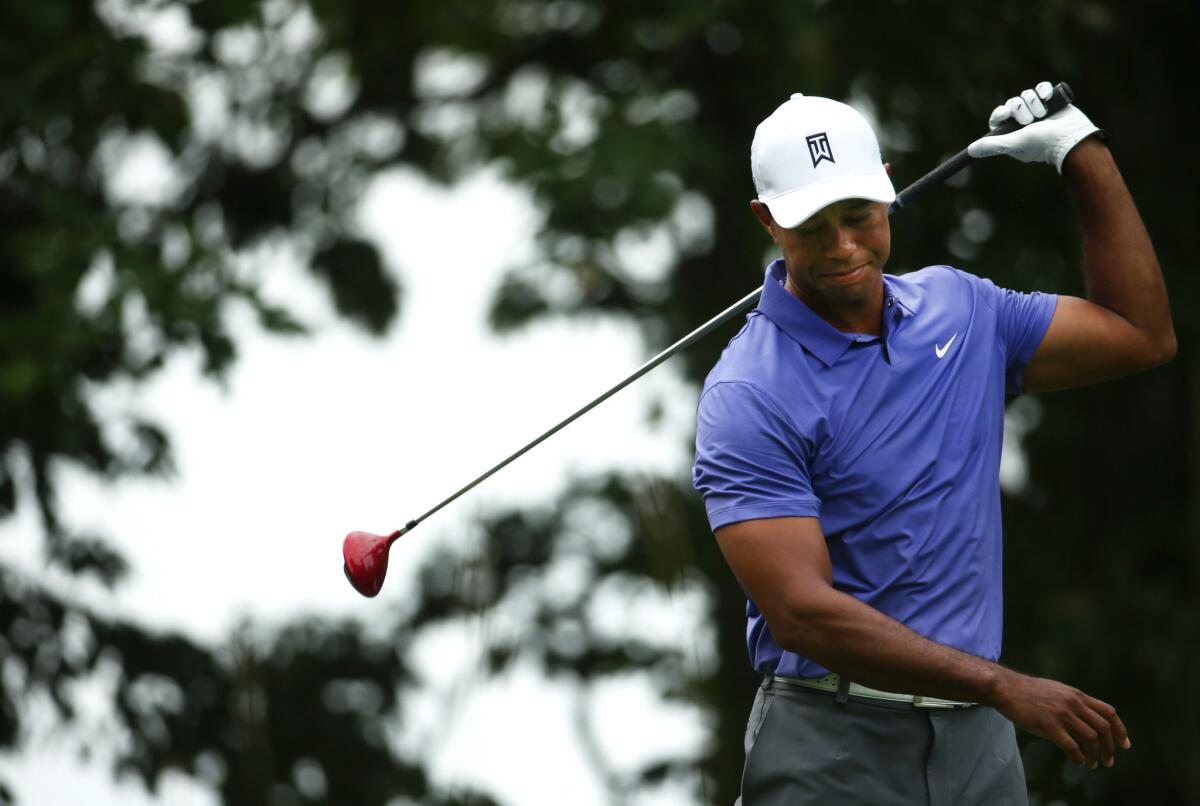 Tiger Woods reacts to a tee shot on the second hole Thursday during the first round of the PGA Championship at Valhalla Golf Club.