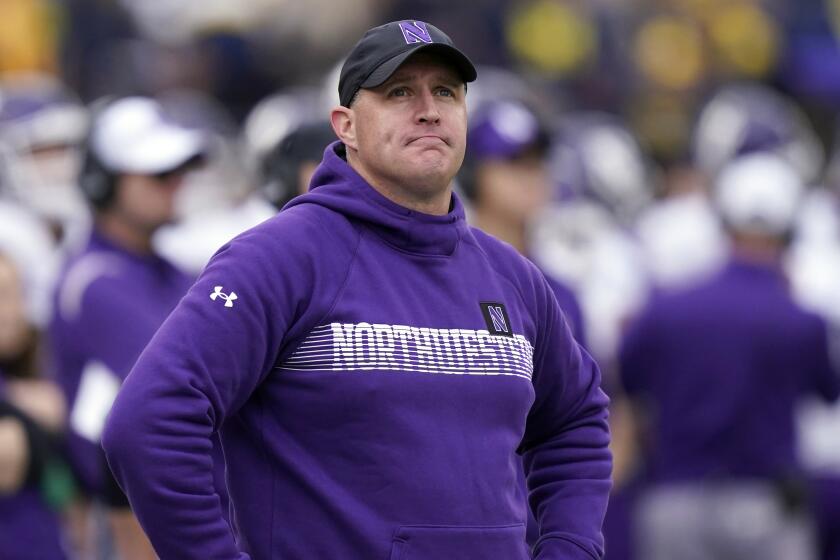 FILE - Northwestern head coach Pat Fitzgerald stands on the sideline during the first half.