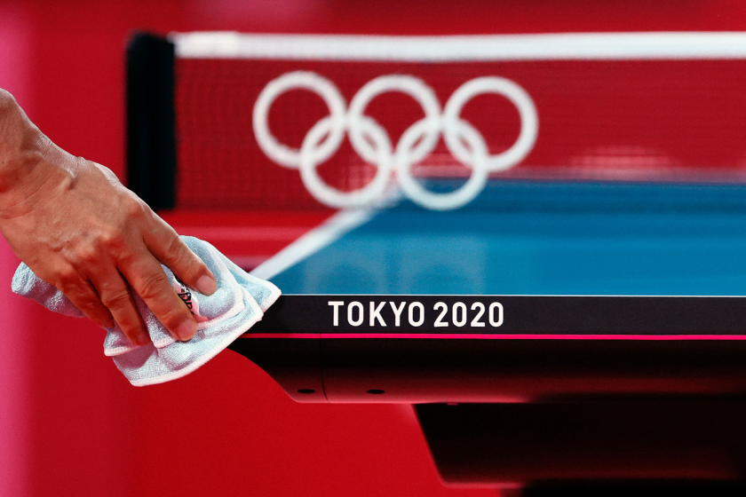 TOKYO, JAPAN - JULY 19: A worker disinfects a table tennis court ahead of the 2020 Tokyo Summer Olympic Games at Tokyo Metropolitan Gymnasium on July 19, 2021 in Tokyo, Japan. (Photo by Steph Chambers/Getty Images)