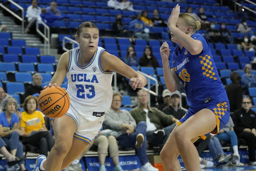UCLA forward Gabriela Jaquez (23) controls the ball against UC Riverside guard Julia Stenberg.