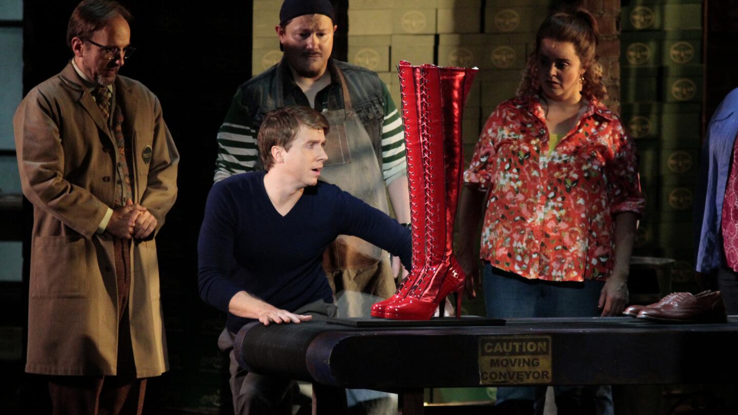 Charlie (Steven Booth, second from left), the inheritor of a hard-luck shoe factory, turns rhapsodic as the first pair of a new product rolls off the line. A touring production of the musical "Kinky Boots" is at the Pantages Theatre in Hollywood through Nov. 30.