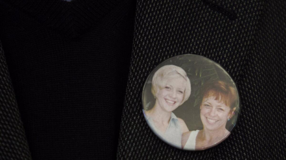 Alan Sudweeks wears a pin on his lapel with a picture of his ex-wife, Sandy, and their daughter, Sunny, who was raped and killed in 1997.