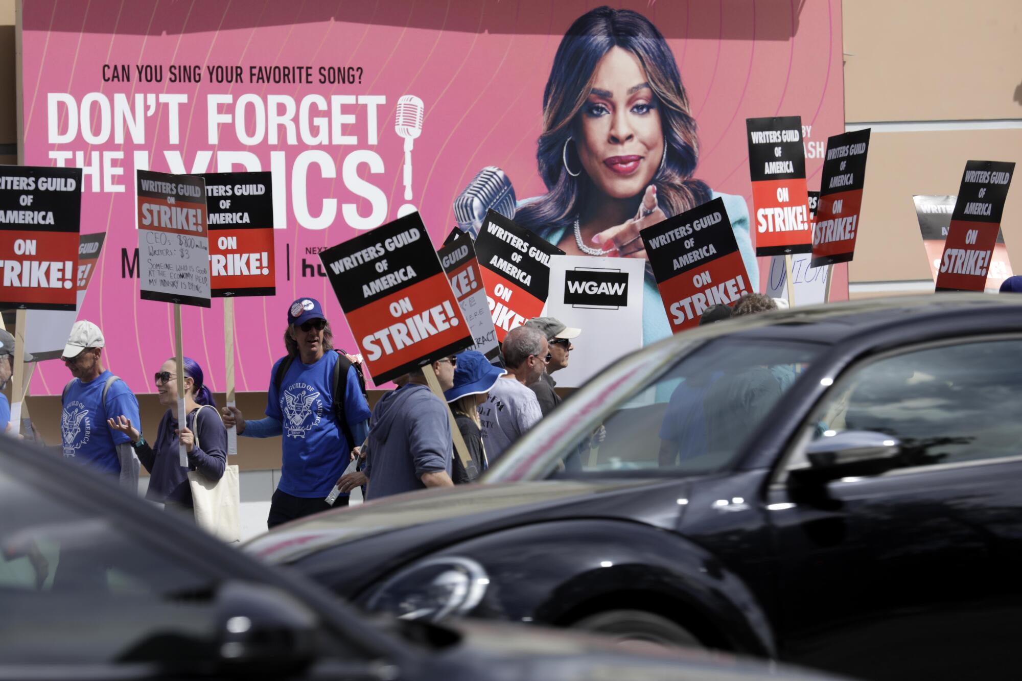 WGA members walk the picket line   in front of Fox Studios 