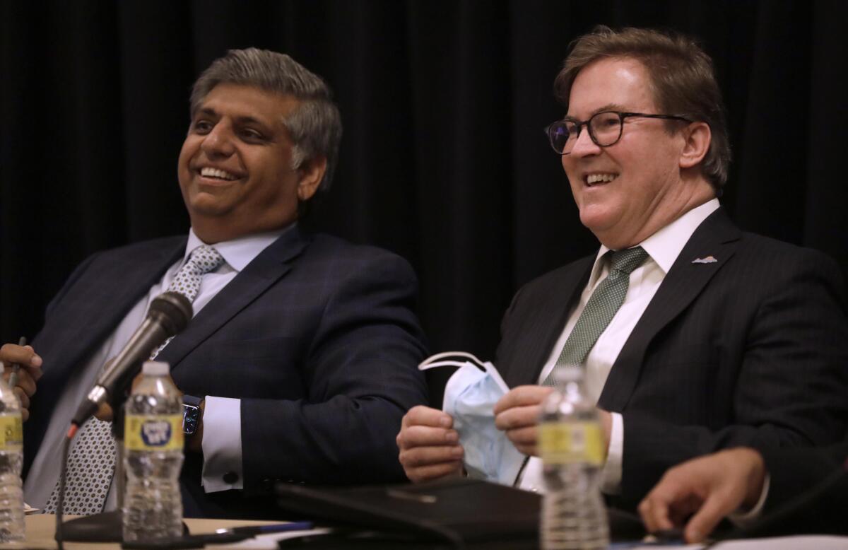 Los Angeles city attorney candidates Faisal Gill, left, and Kevin James at a forum at Cal State L.A.