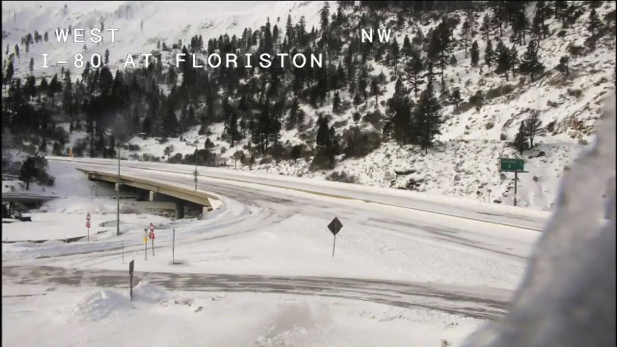 A snow-covered Interstate-80 is shown in a Caltrans image