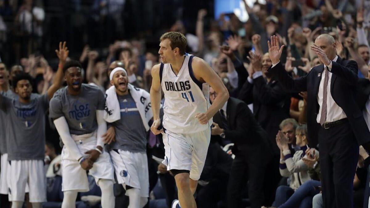 Mavericks forward Dirk Nowitzki (41) runs downcourt after scoring his 30,000th career point in the second quarter against the Lakers on March 7.