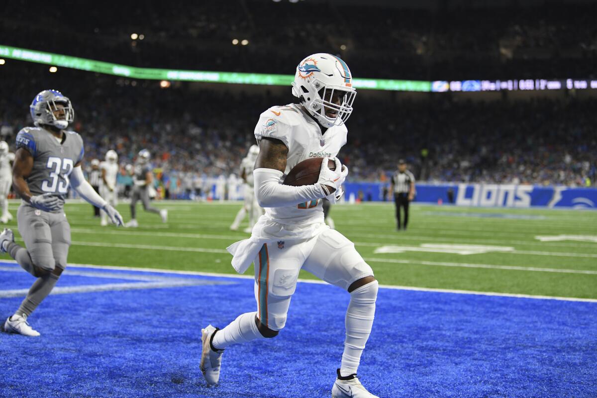 Dolphins wide receiver Jaylen Waddle catches a touchdown pass against the Detroit Lions on Oct. 30, 2022.