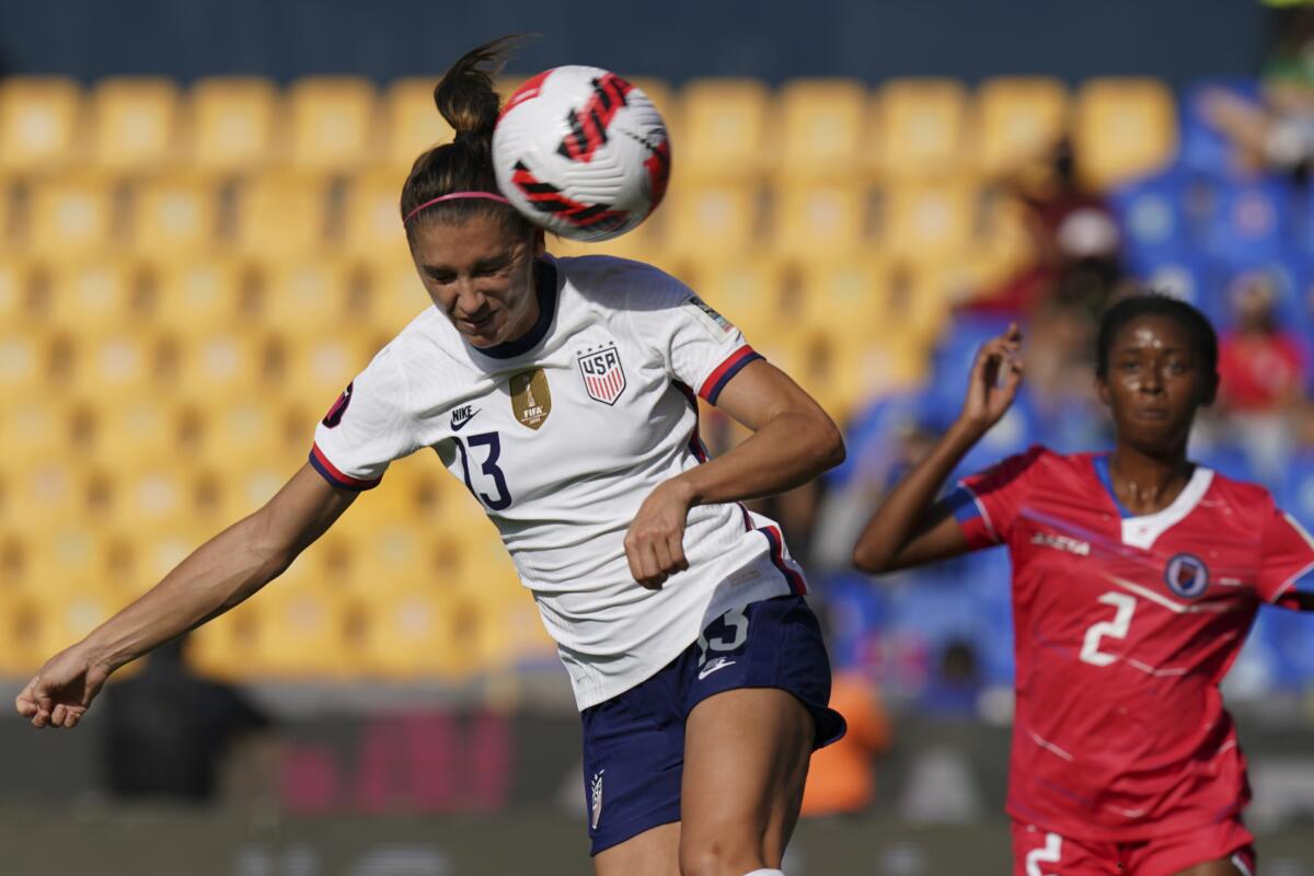 United States' Alex Morgan goes for a header during a CONCACAF Women's Championship match against Haiti.