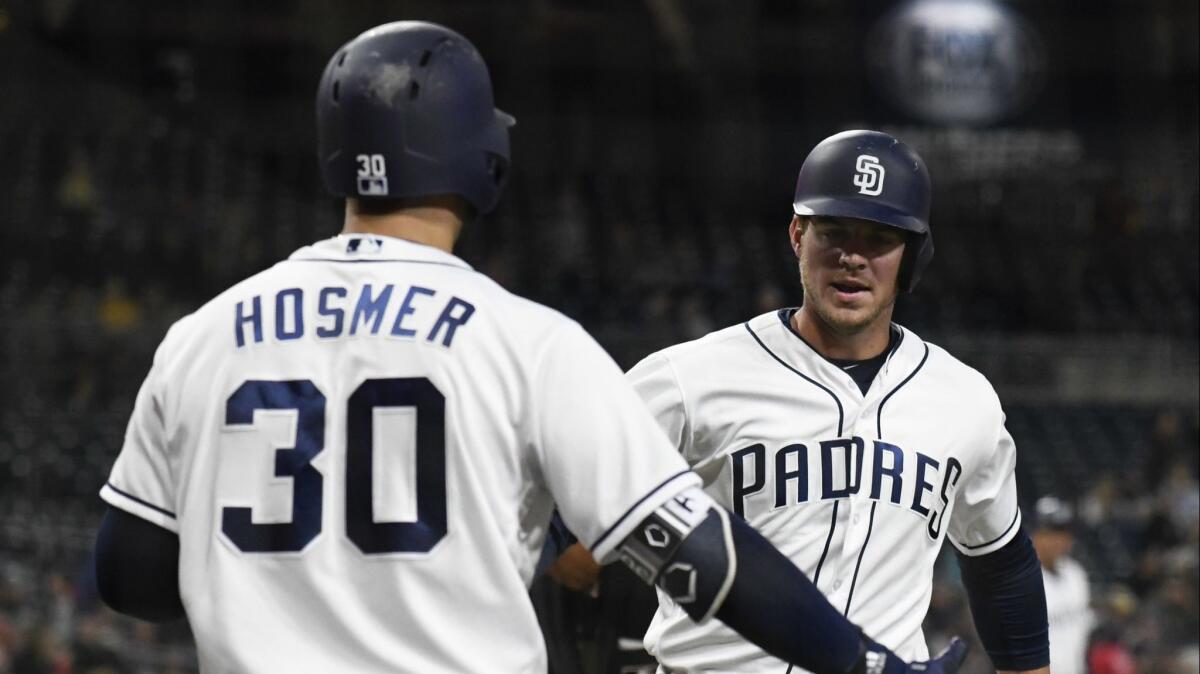 Wil Myers is congratulated by Eric Hosmer after hitting a home run during on April 2.