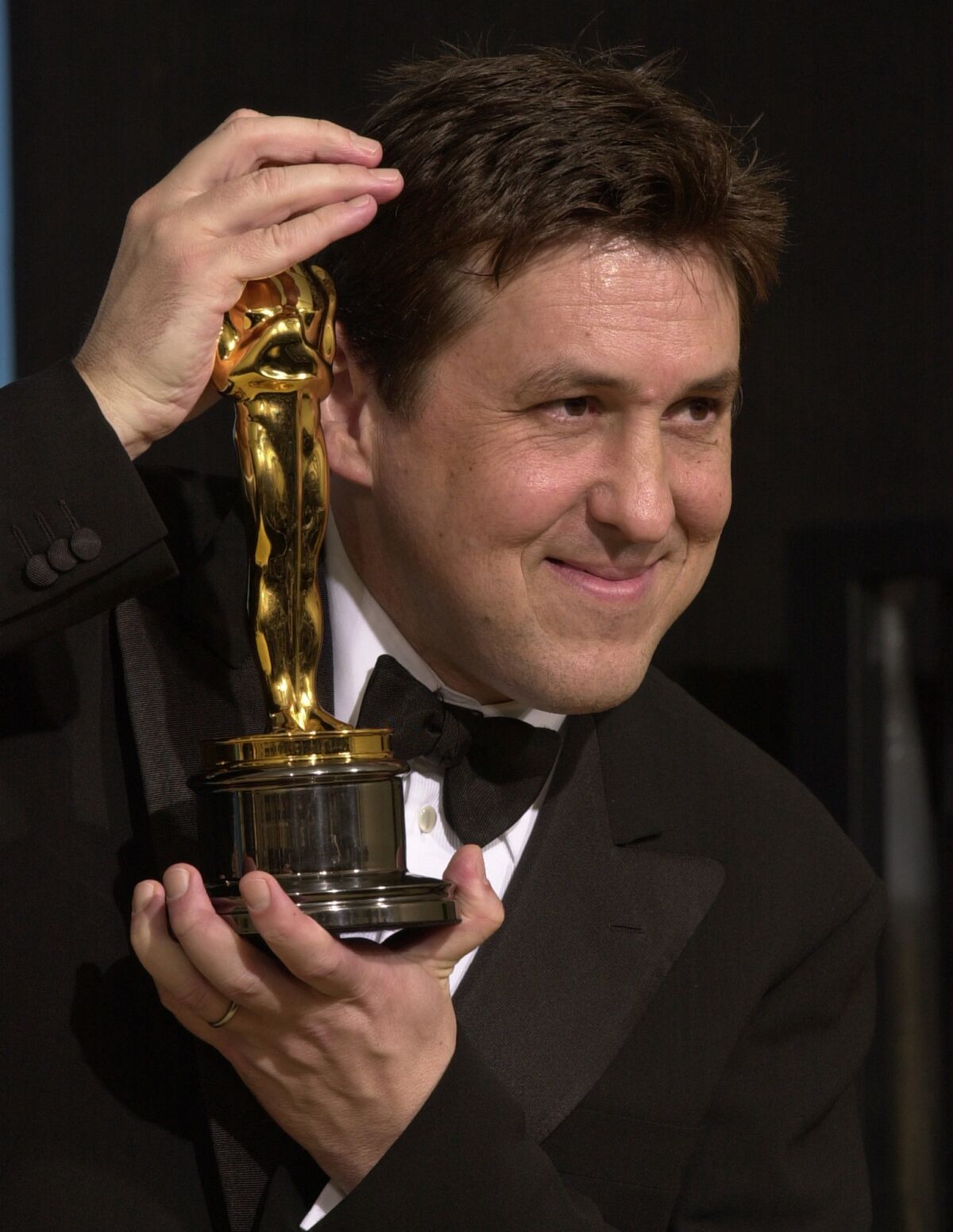 Cameron Crowe shows off his Oscar for the screenplay to "Almost Famous" in 2001.