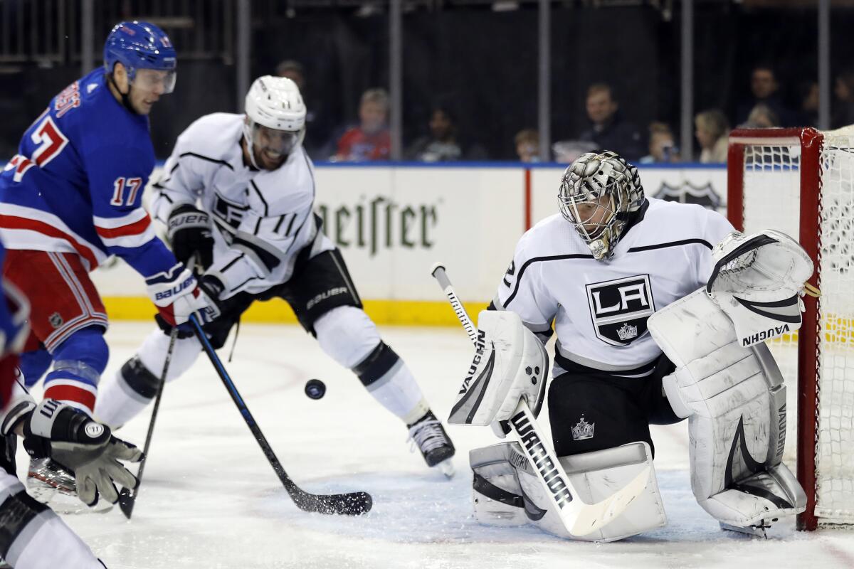Kings goaltender Jonathan Quick makes a save against the New York Rangers in the second period of a 4-1 loss Sunday.