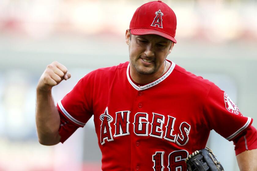 Angels closer Huston Street reacts after recording the final out in Game 1 of a doubleheader against the Twins on Saturday in Minneapolis.