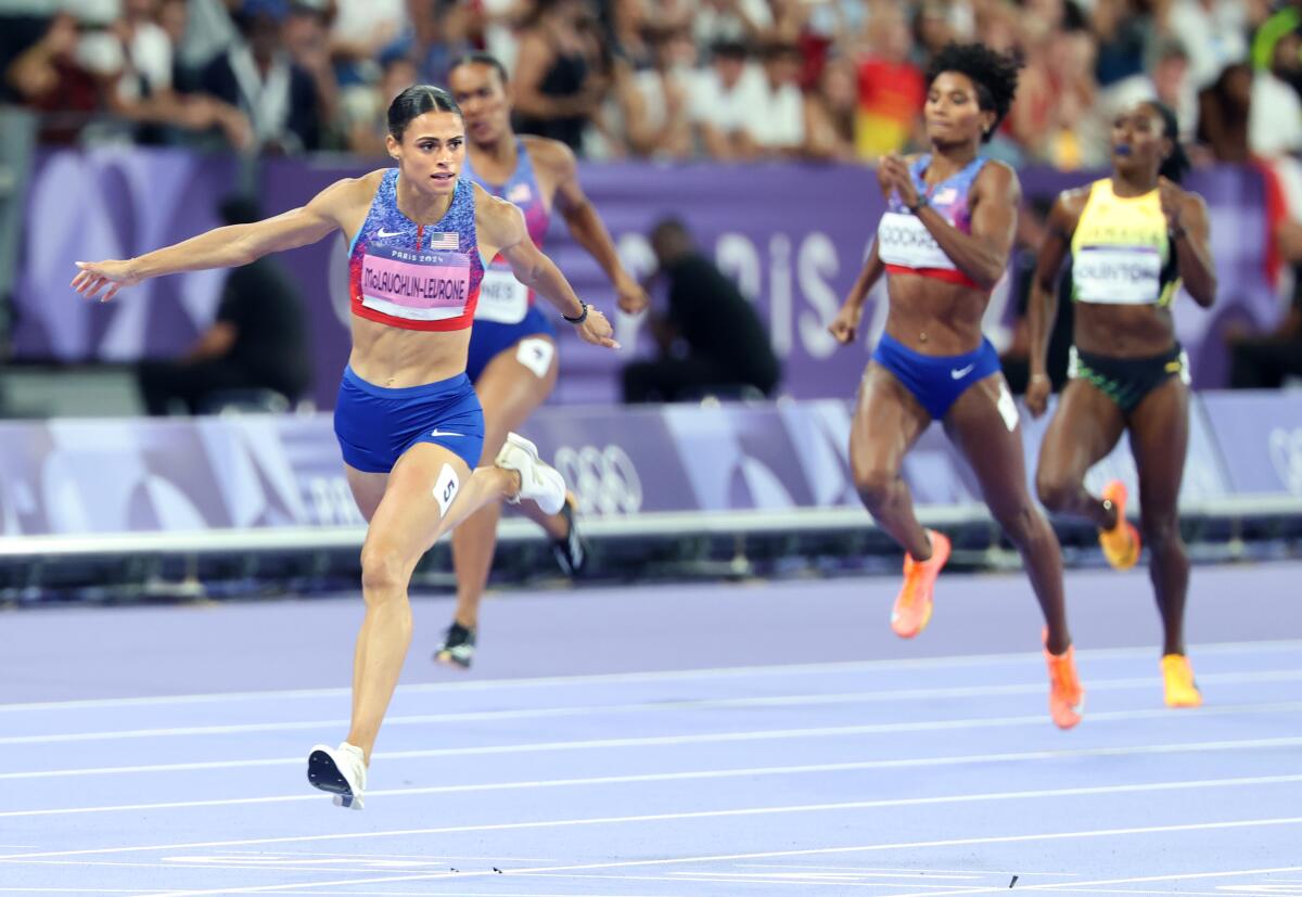 Sydney McLaughlin-Levrone wins the women's 400 hurdles in world record time.