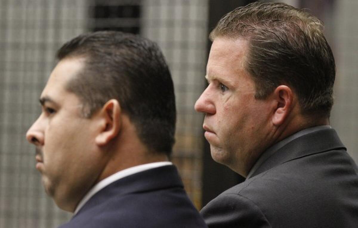 Former Fullerton police officers Manuel Ramos, left, and Jay Cicinelli in court in 2012.