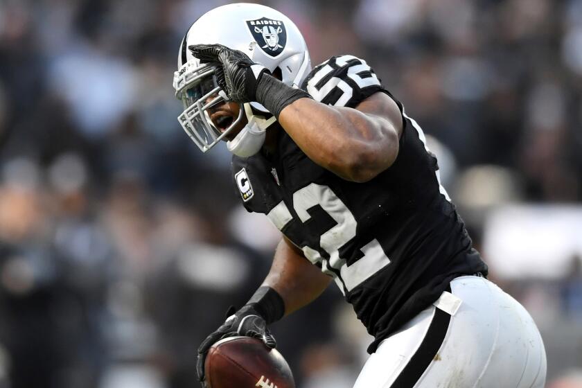 Raiders linebacker Khalil Mack celebrates after recovering a fumble during a game against the Bills on Dec. 4.