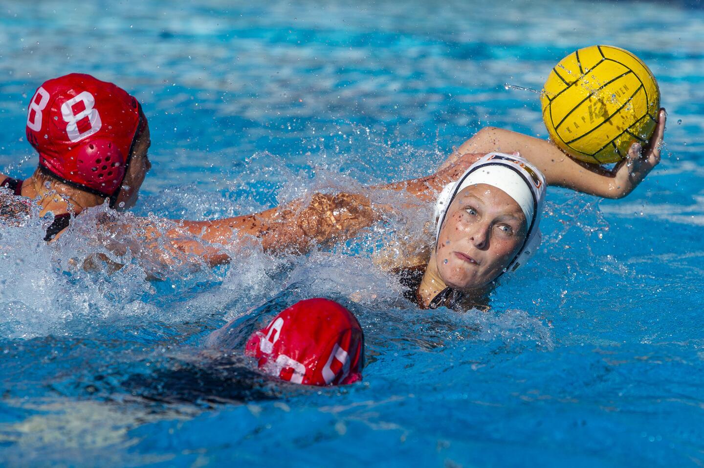 Huntington Beach's Shanna Zuanich winds up to take a shot under pressure from San Clemente's Alex Higginson during a second round CIF-SS Division 2 playoff game on Friday, February 8.