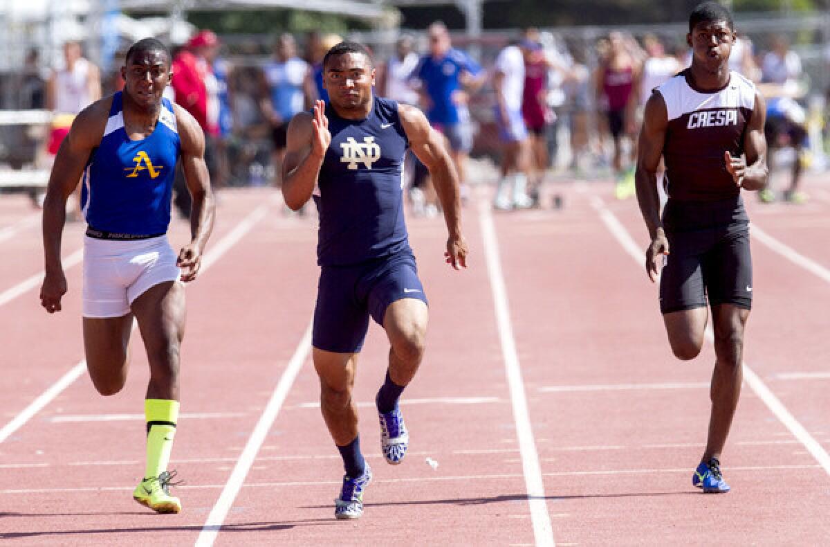 Notre Dame's Khalfani Muhammad leads Bishop Amat's Darren Andrews, left, and Crespi's Tarrick Brock in the 100 meters at the Southern Section Division 3 track meet.