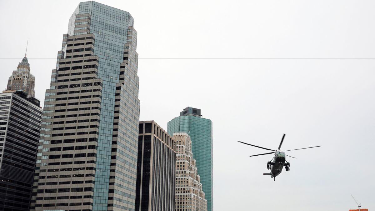 President Trump, aboard Marine One, prepares to land near Wall Street in New York on Thursday. Although he's a native New Yorker, his budget priorities tilt away from the big, Democratic cities that opposed him in the election.