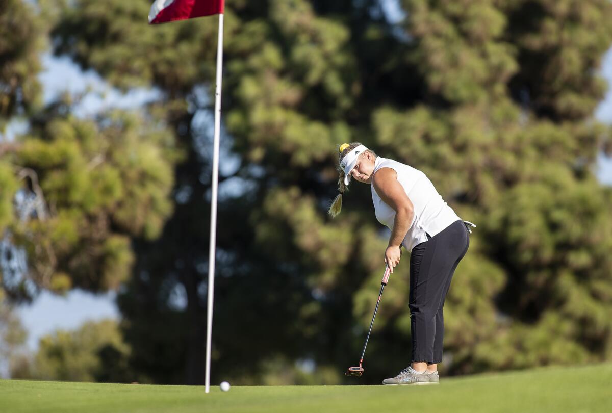 Edison's Erin Johnson putts in a Sunset Conference crossover match against Huntington Beach at SeaCliff Country Club in Huntington Beach on Tuesday.