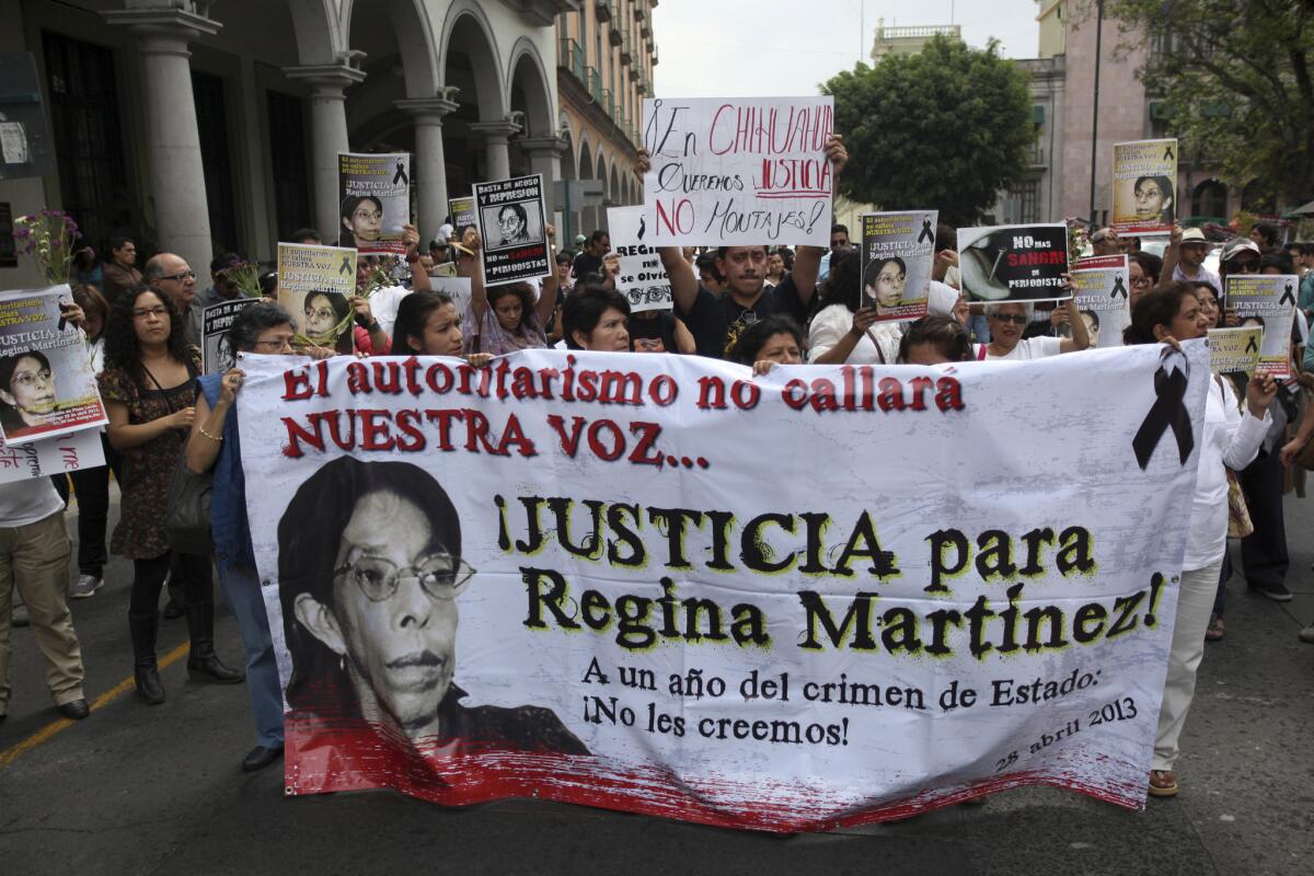 Journalists march in Veracruz, Mexico, on Sunday, the anniversary of the death of journalist Regina Martinez. Others marched in other state capitals to protest violence against members of the news media.