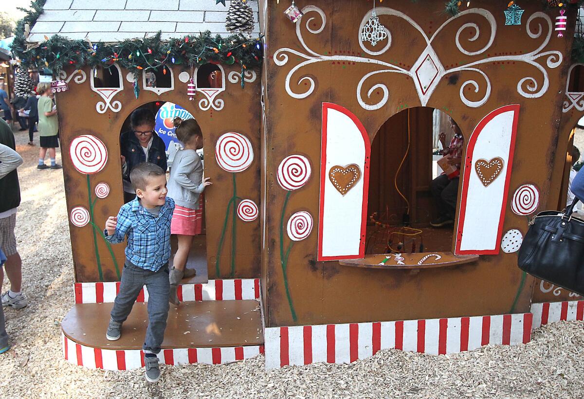 Kids run in and out of the gingerbread playhouse during the Sawdust Art Festival's Annual Winter Fantasy in 2015. This year's Winter Fantasy opens Nov. 20.