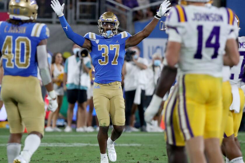 PASADENA, CALIF. - SEP. 4, 2021. UCLA defensive back Quentin Lake begins celebrating the Bruins' victory against LSU at the Rose Bowl on Saturday, Sept. 4, 2021. (Luis Sinco / Los Angeles Times)
