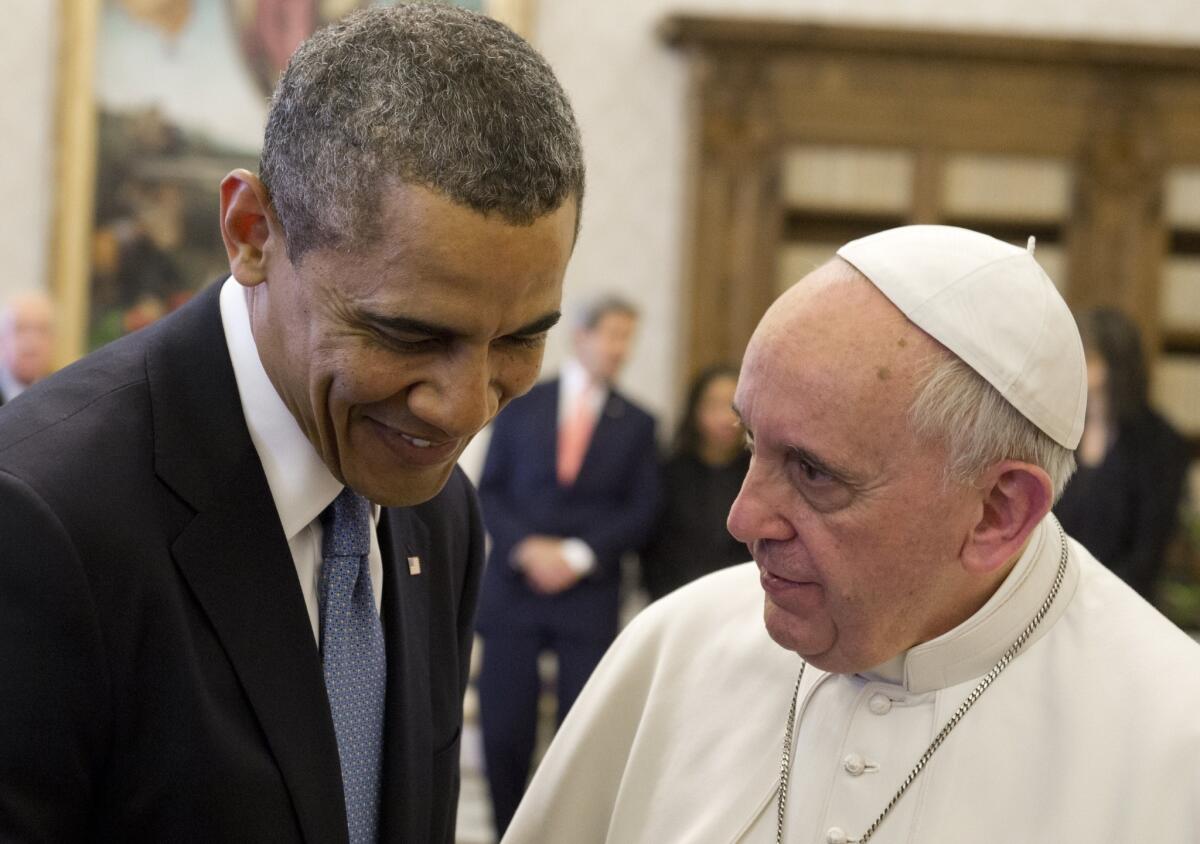 President Obama and Pope Francis speak in March 2014 in a private audience at the Vatican.