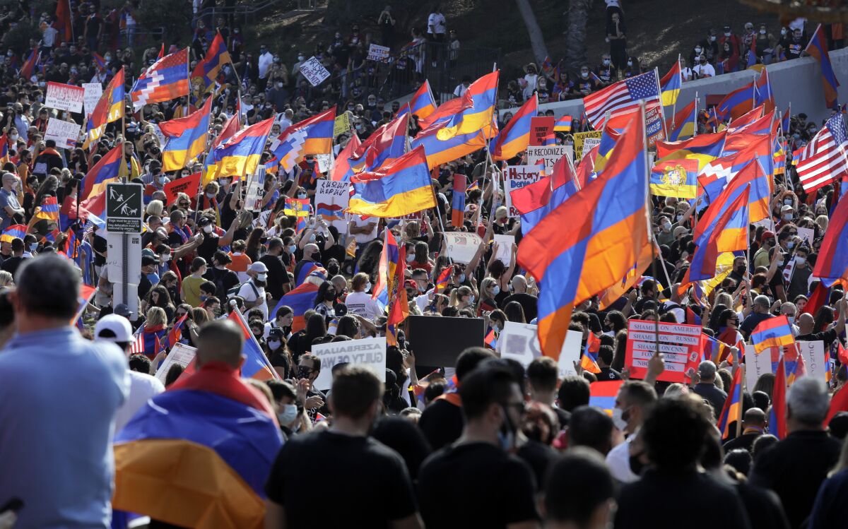 Armenians protest military aggression by Turkey and Azerbaijan during a rally Oct. 11 in Pan Pacific Park in Los Angeles. 