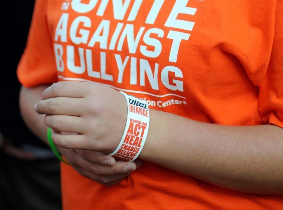 A student in Blue Earth, Minn., wears a T-shirt and wristband in support of National Bullying Prevention Month.