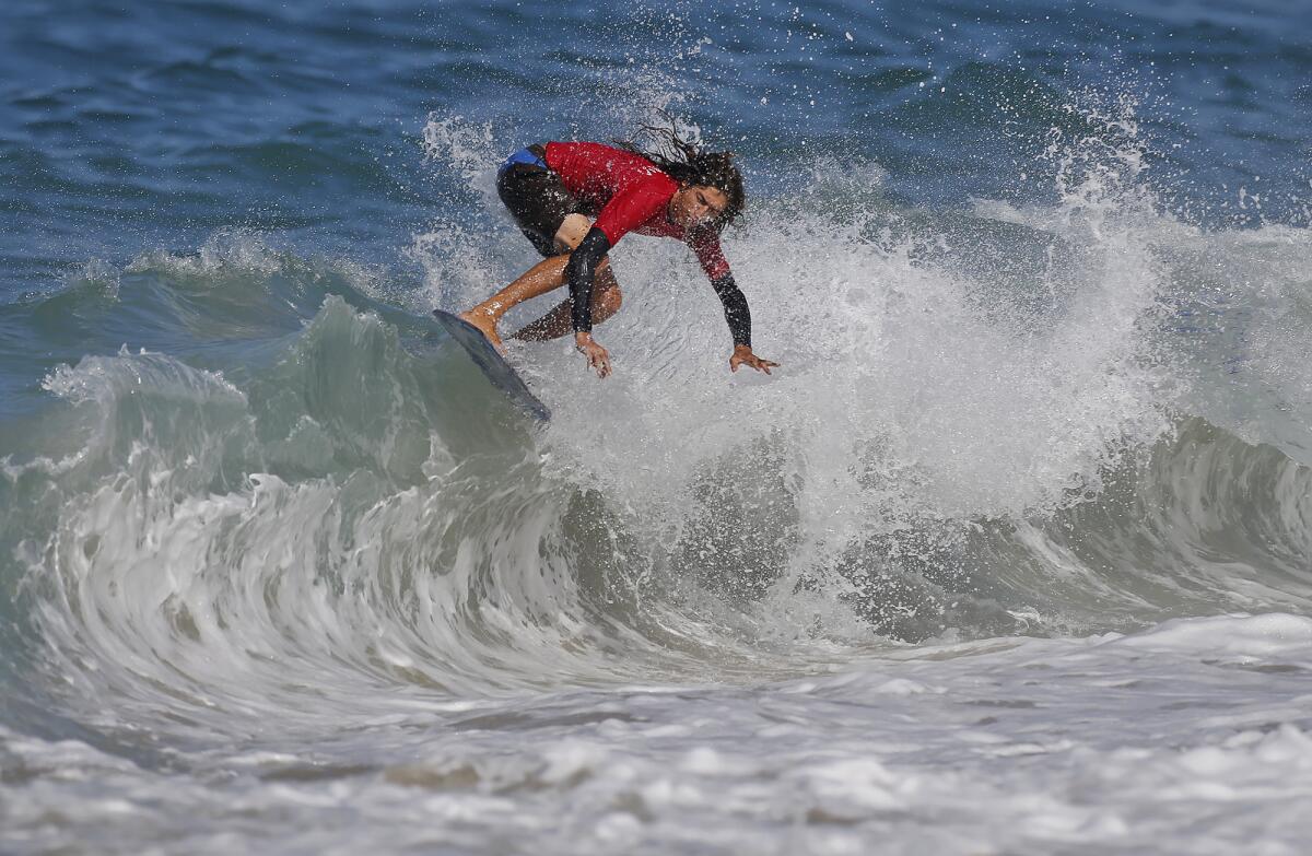 Pro rider Timmy Gamboa completes a "floater" on the shore break as he competes in the semifinal of "The Vic."