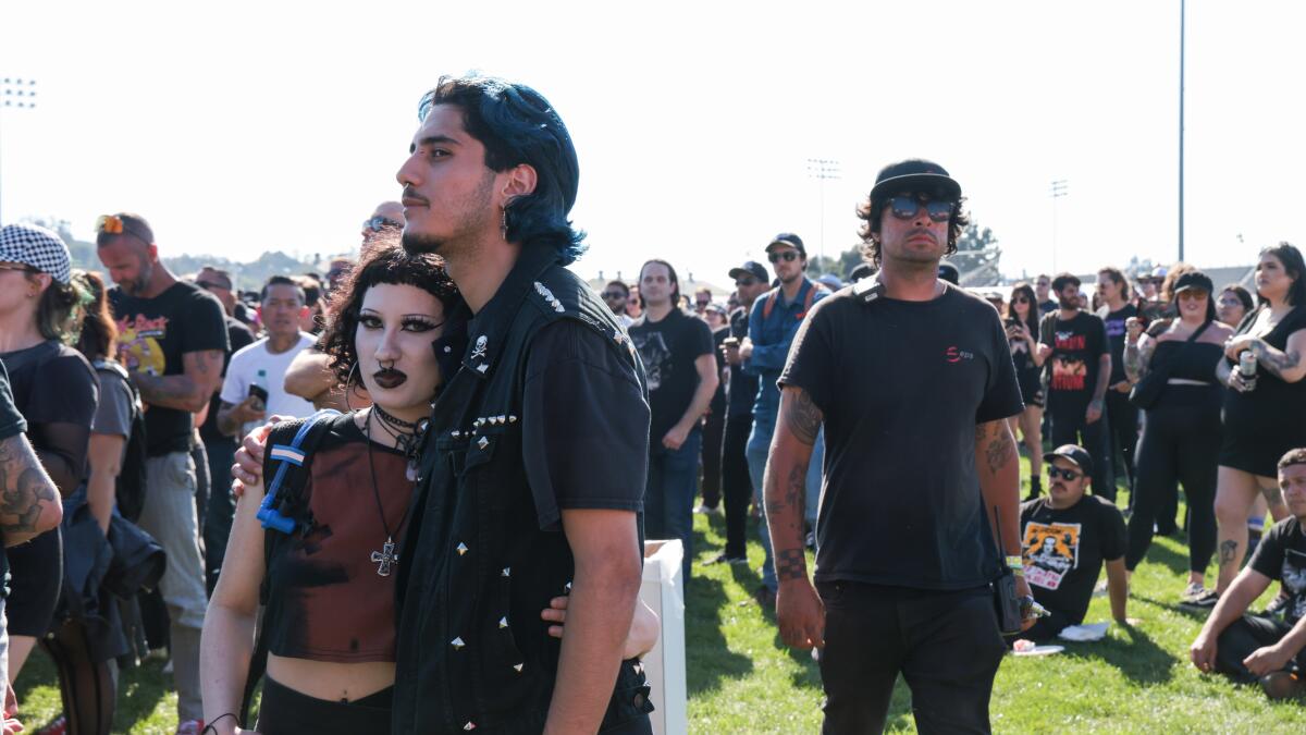 Punk rock festivalgoers standing in a field