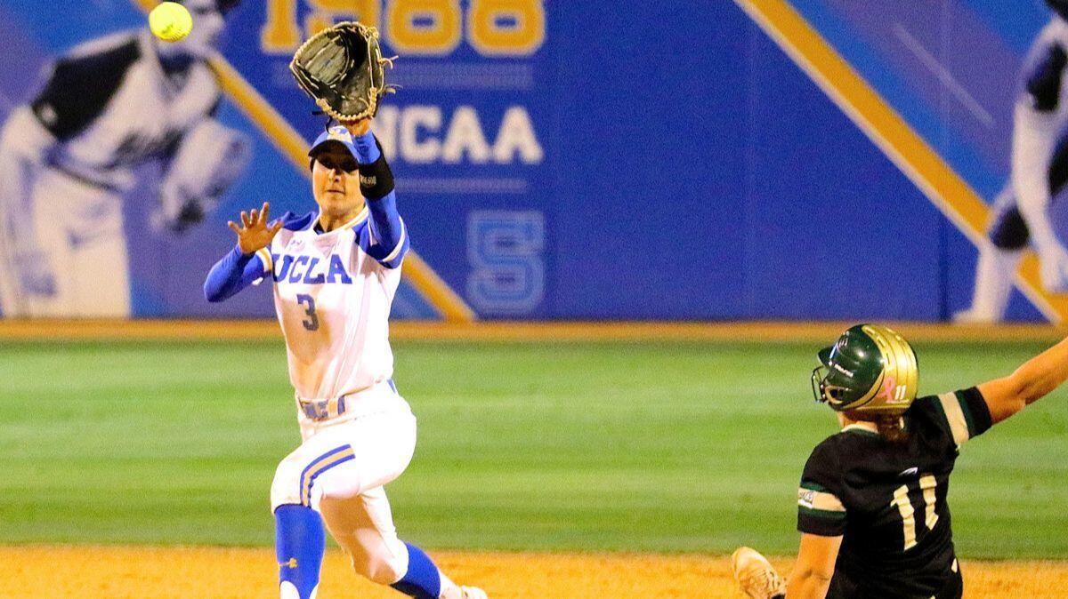 UCLA shortstop Briana Perez catches the ball at second base to force out Sacramento State's Sydney Rasmussen.