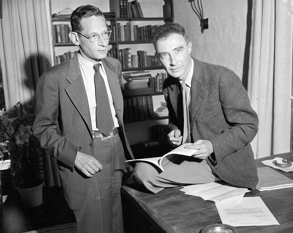 Dr. J. Robert Oppenheimer, right, who was in charge of the atomic research laboratory in Los Alamos, N.M. and credited with contributing heavily to the development of the atomic bomb, chats with Dr. Robert Serber of the University of California's radiation laboratory at Berkeley, Calif., April 23, 1946. (AP Photo)