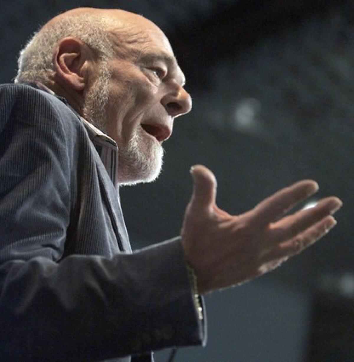 Investor Sam Zell, shown speaking to Los Angeles Times employees in 2007, weighed in Wednesday on President Trump's trade battle with China.