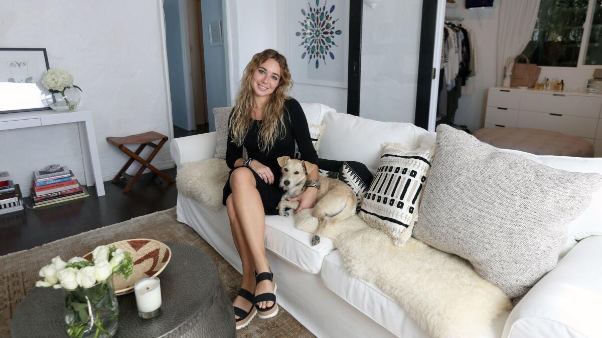 Hutch co-founder Beatrice Fischel-Bock, and her dog Ellie. Fischel-Bock used her own app to 'adult-ify' her Spanish-style bungalow.