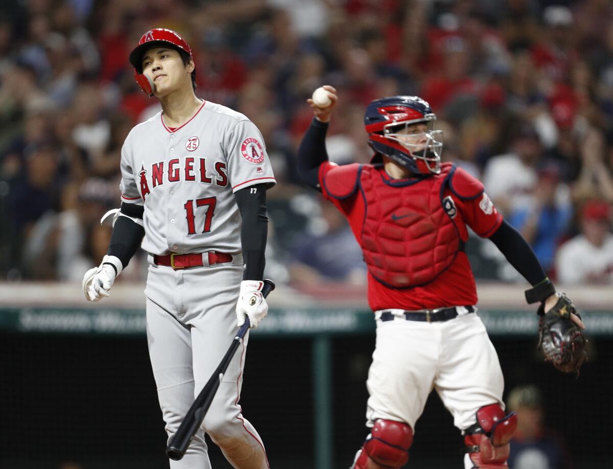 Angels' Shohei Ohtani reacts after striking out in the eighth inning against the Indians on Friday in Cleveland.