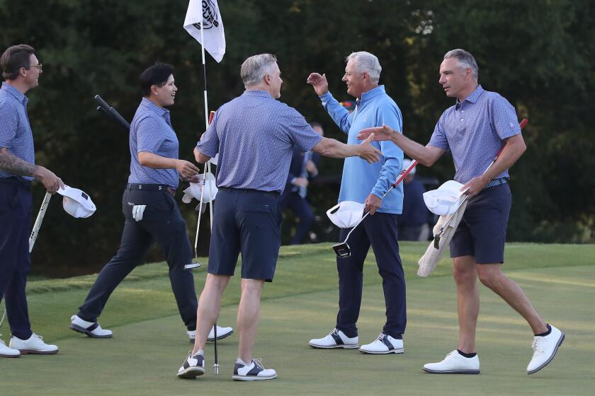 Members of the Shady Canyon Country Club celebrate on the 18th hole after winning the 2024 Jones Cup golf tournament at their home course on Wednesday.