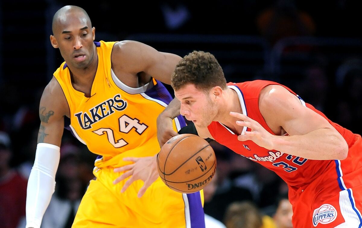 Lakers guard Kobe Bryant tries to steal the ball from Clippers forward Blake Griffin during a game at Staples Center on Feb. 14, 2013.