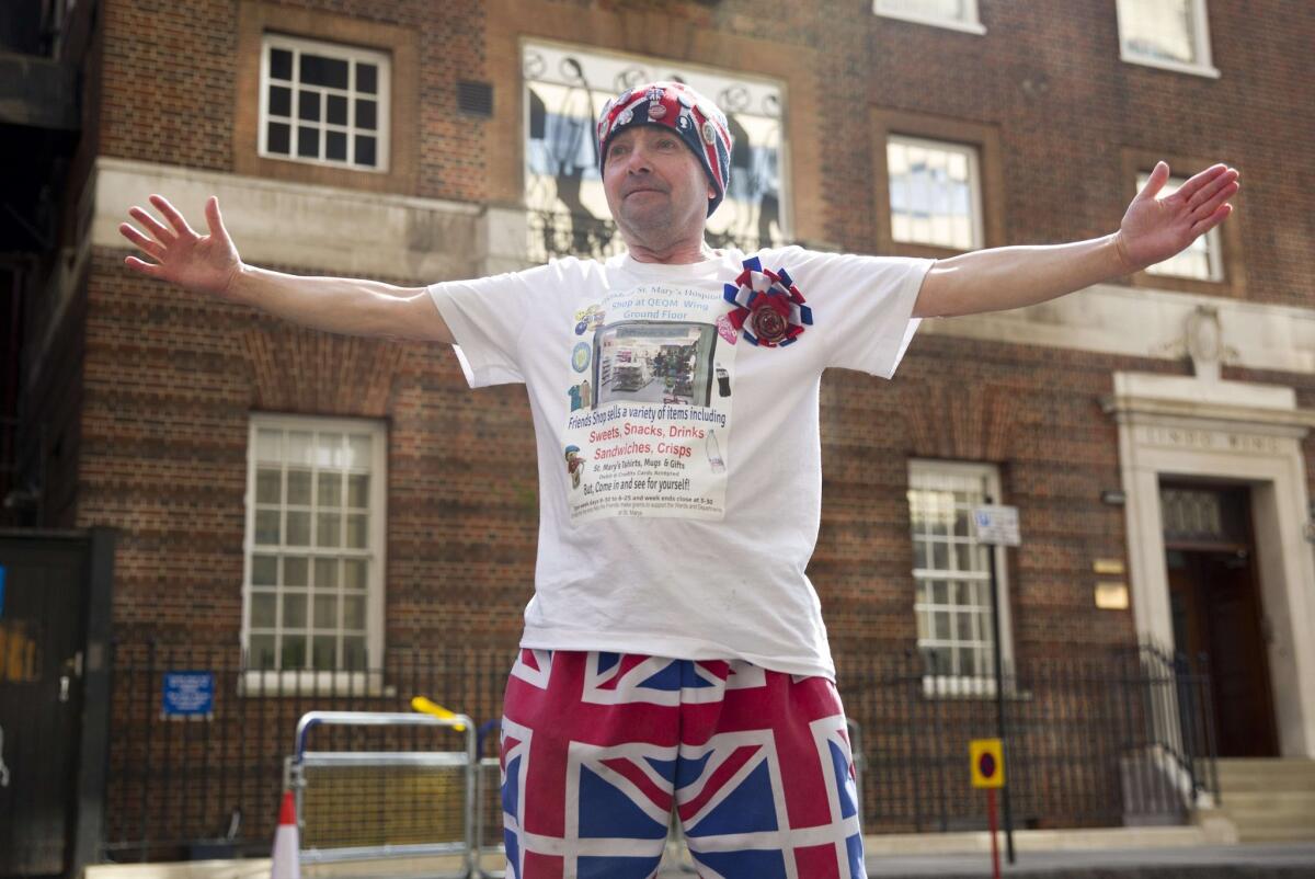 Royal fan John Loughrey poses for photographers outside the Lindo Wing of St. Mary's Hospital in central London on April 17.