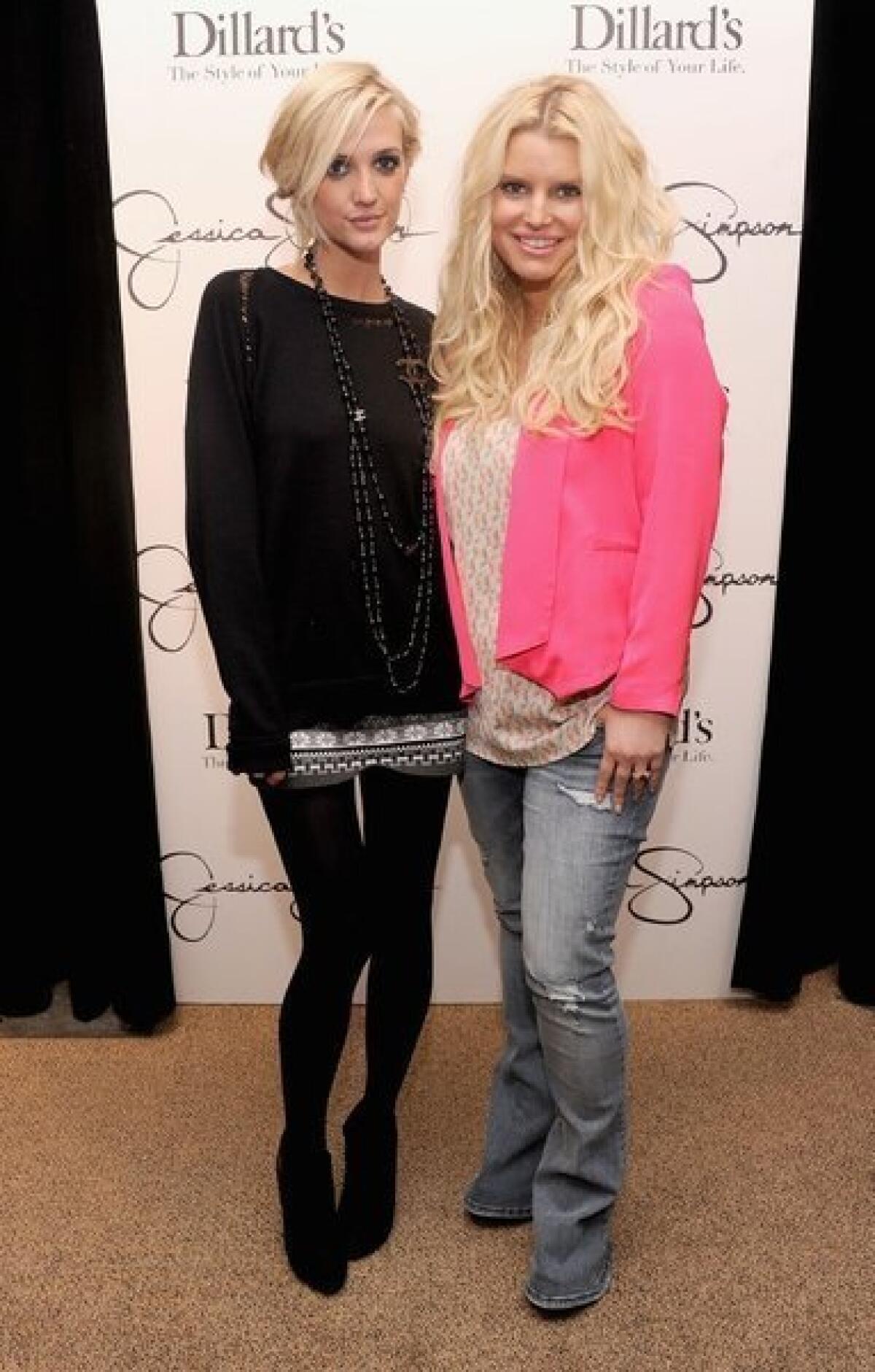 Jessica Simpson, right, with sister Ashley at Dillard's in Tampa, Fla., shows off her 60-pound weight loss.