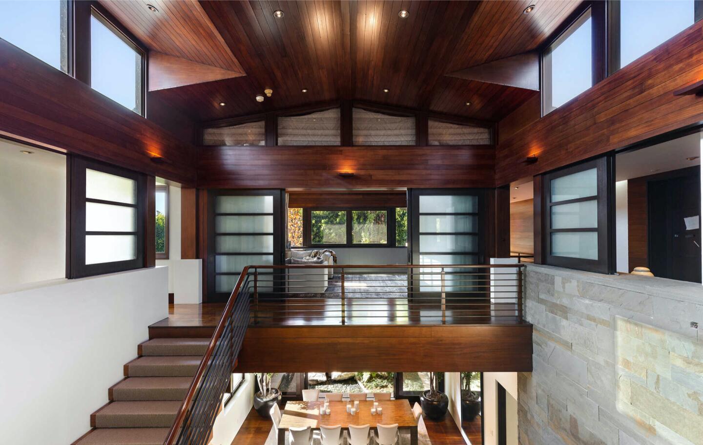 The wooden atrium above stairs and a landing.