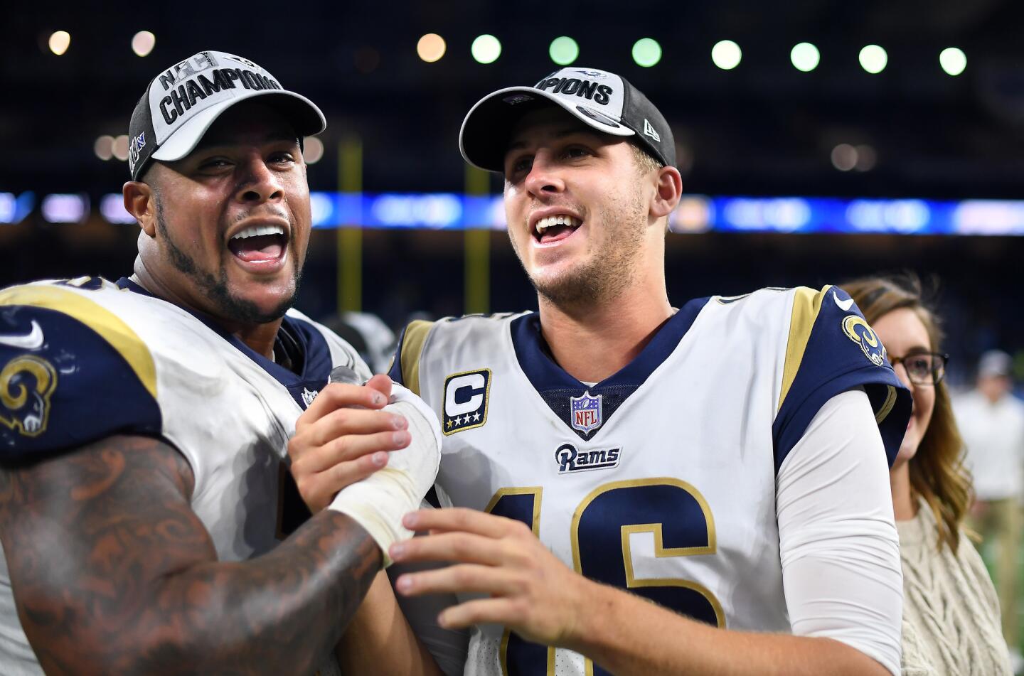 Rams gurd Rodger Saffold, left, and qaurterback Jared Goff celebrate after defeating the Detroit Lions at Ford Field in Detroit on Sunday.