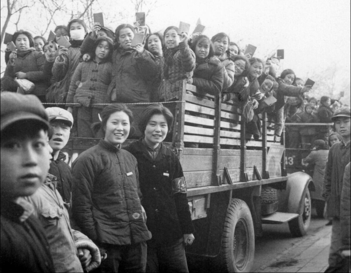 A 1966 image shows a propaganda squad of Red Guards, high school and university students, brandishing copies of Chairman Mao Tse-tung's Little Red Book in Beijing.