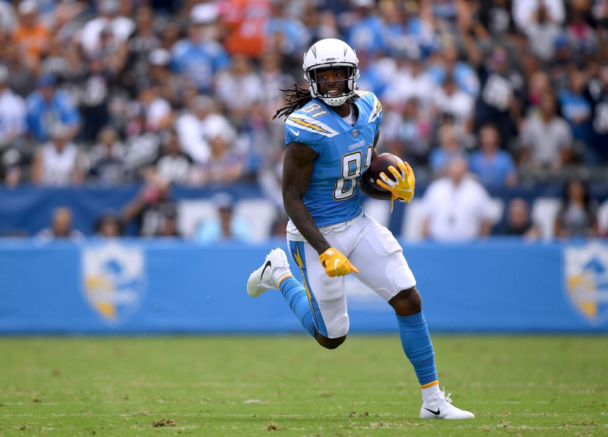 Chargers wide receiver Mike Williams carries the ball.